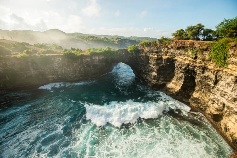 Broken Beach is a natural rock arch formation on the west side of Nusa Penida, often featured in West Nusa Penida tour itineraries alongside Kelingking Beach and Angel’s Billabong.